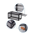 User placing bait on the pedal of the live squirrel trap.