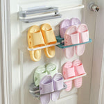 The space-saving folding shoe rack shown neatly folded flat against a wall.