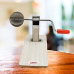 The sleek, shiny stainless steel components of the Quickslice coconut scraper.