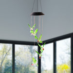 Multicolor LED glowing hummingbird wind chime shining at night