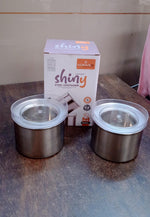 Empty 500ml Konvex stainless steel food storage container with its transparent airtight lid.