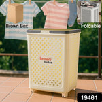 Foldable laundry basket with wheels placed in bedroom setting