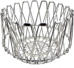 Multipurpose stainless steel wire basket transformed into a stylish fruit bowl for dining.