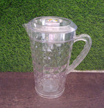 Clear Mocktail PET Plastic Jug with a vibrant orange slice inside, suggesting a refreshing drink.