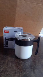 Close-up side view of the white insulated mug on a flat surface.