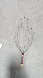 The compact handheld scalp massager, ideal for gifting for health and wellness.