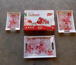 Complete 3-piece plastic serving tray set with a decorative pattern, neatly stacked.