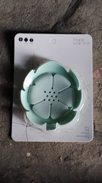 Back view of the plastic soap dish showing its draining holes.