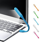USB LED Light Lamp with a book, highlighting its use for reading.