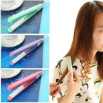 A hand holding the compact ceramic mini hair styler, showcasing its portable design.