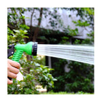 Detailed view of the garden hose nozzle's quick connect mechanism.