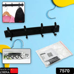 Close-up view of the durable metal hooks on the wooden wall mount coat hanger.