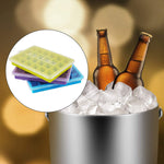 Several stackable multicolor silicone ice cube trays in a freezer.