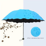 Detailed view of the water-activated peach flower print on the Magic Umbrella canopy.