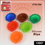 Close-up of a lit silicone diya, highlighting its vibrant colour and intricate design.