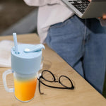 Ergonomic portable juicer with handle, showcasing its 340ml capacity.