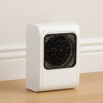Compact brown box room heater on a clean surface.