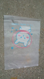 Reusable zip pouch filled with cosmetics, demonstrating its utility as a makeup bag.