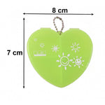 Heart-shaped pill organizer on white background
