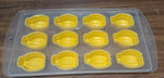 Glass of chilled beverage with delightful fruit-shaped ice cubes and the silicone mold.
