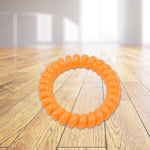 Close-up of a soft, stretchy telephone wire hairband.