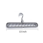 Close-up view of the nine precisely designed holes on the plastic hanger for secure garment storage.