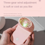 White multi-function fan detached from its base, highlighting its travel-friendly design.