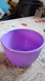 Round plastic bowl, easy to clean and maintain for busy lifestyles.