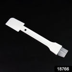 Small dust cleaning brush effectively cleaning keyboard keys.