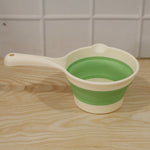 Foldable water dipper in action for home use