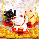 Waving Lucky Cat on a car dashboard, perfect for travel and good luck.