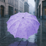 A closed Magic Umbrella with a subtle blossom pattern, ready for rain surprises.