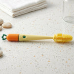 Close-up of bottle cleaning brush highlighting the silicone head and long handle.
