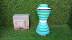 A BPA-free silicone collapsible water bottle standing on a clean surface.