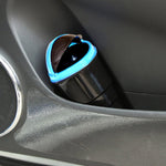 Multicolor plastic car dustbin with a spring lid, designed for easy trash disposal.