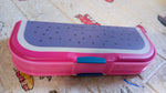 Top view of a cartoon printed pencil case with two organized compartments.