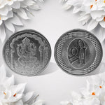 Hand holding the auspicious Decorative Ganesh Coin, ready for pooja or gifting.