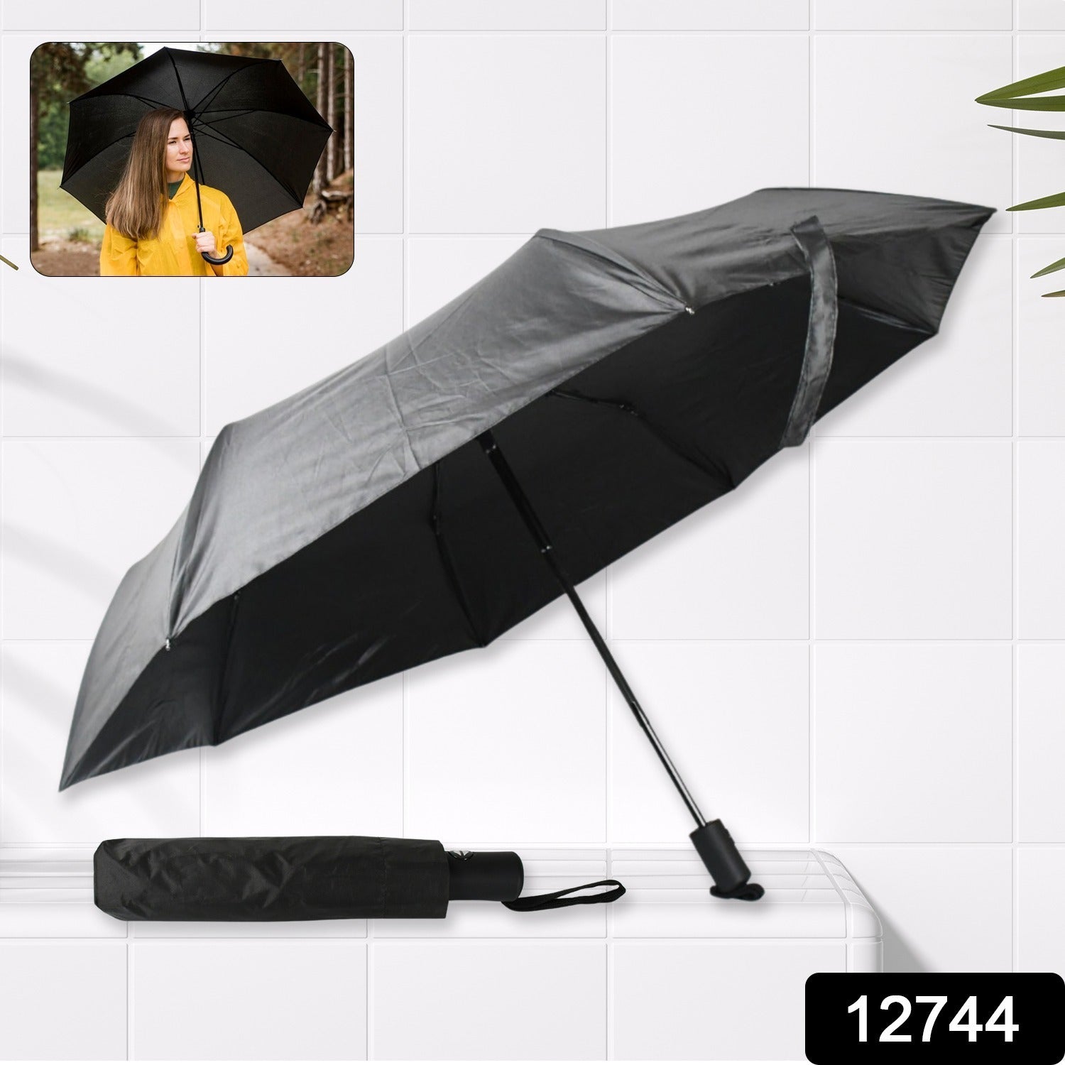 Neatly folded compact umbrella with a secure wrist strap, ready for travel or storage.