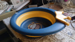 Angled view of the foldable baby wash basin, highlighting its practical and compact design.