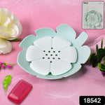 Top-down view of the self-draining plastic soap holder, showcasing its petal-like structure.