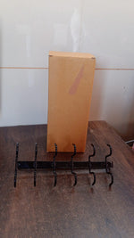 Space-saving cup holder rack mounted under kitchen cabinet showing organized mugs.