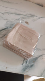 Scalloped edge tissue napkins styled for elegant table setting