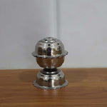 Agarbatti burning in a Lotus incense holder, creating a serene ambiance.