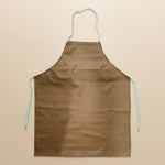 Kitchen apron worn during active cooking tasks