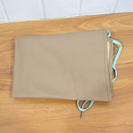Close-up view of durable apron fabric and stitching