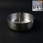 Round tabletop cigarette ashtray showing multiple rest slots and deep bowl