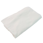 Compact bath towel folded into a small puck for travel