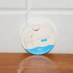 Compressed travel towel in its single-use hygienic pack