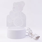Teddy bear LED Night Lamp glowing softly in dark room