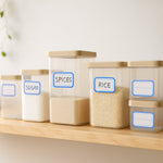 Rectangular label stickers adhered on kitchen containers for organization